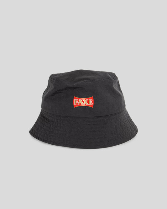 A black bucket hat with a red and white 'FAKE' logo patch on the front, photographed against a solid light gray background.